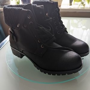 Military style, heeled boots with a knit cuff and buckle detail. NWT